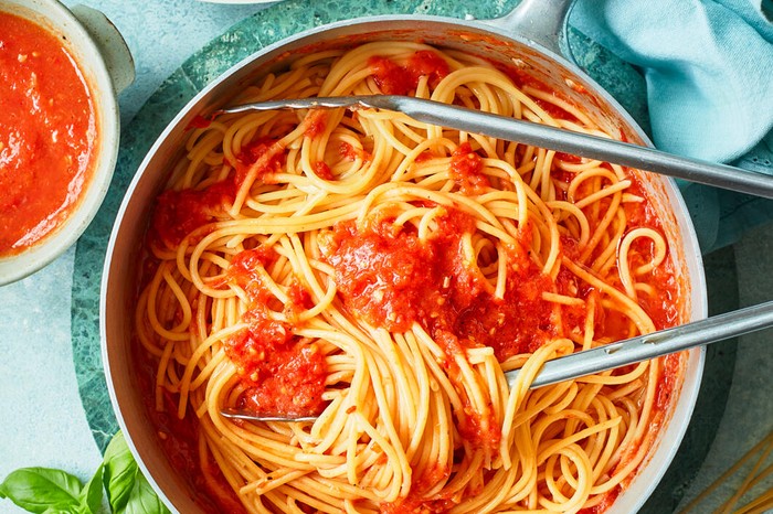 Spaghetti with slow-roast tomato sauce in a pan